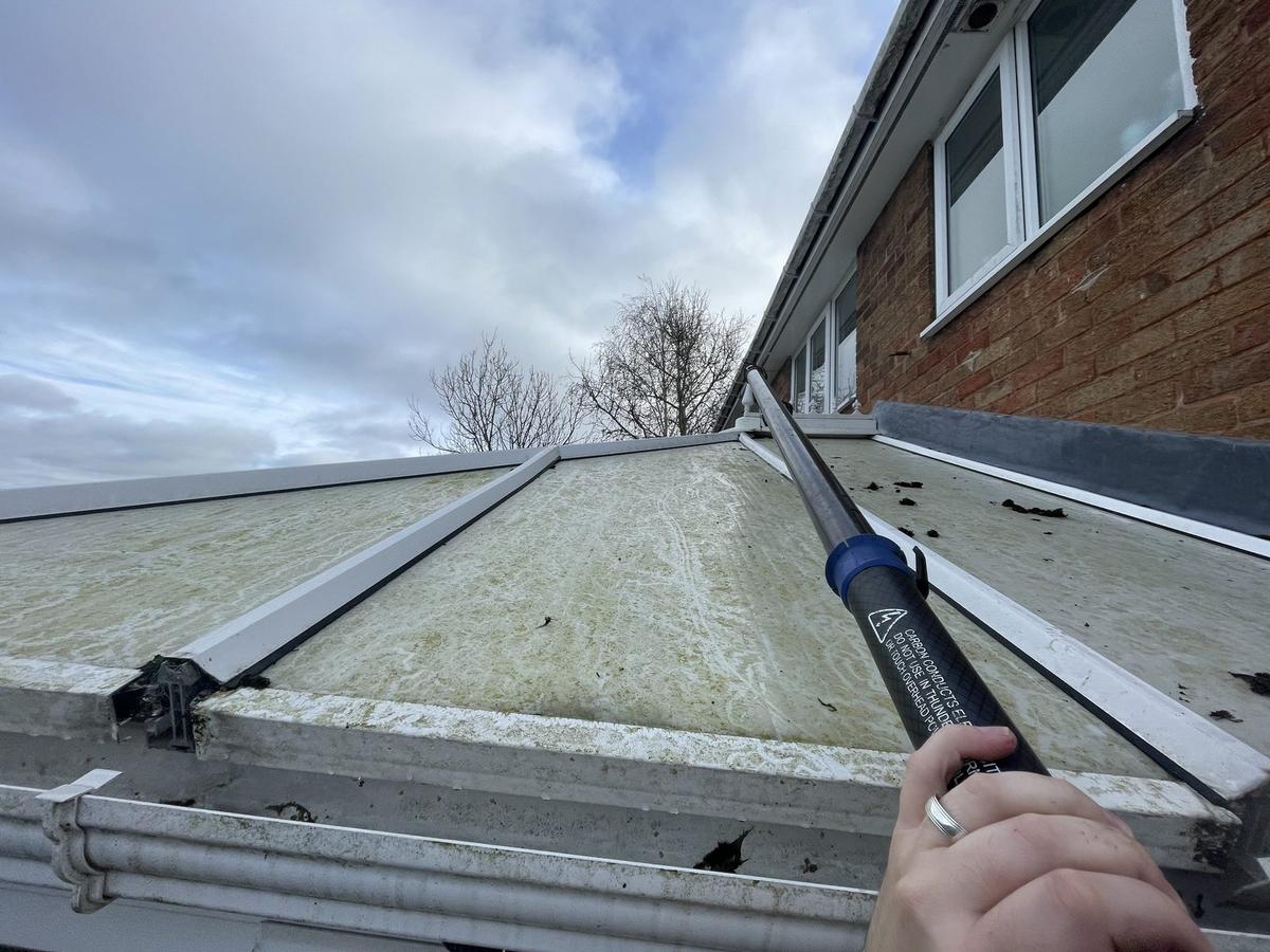 Conservatory roof before cleaning, algae on polycarbonate panels