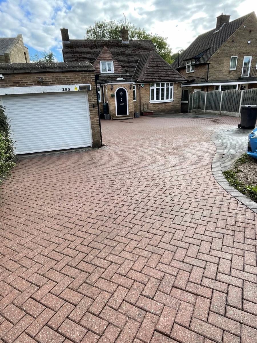Cleaned herringbone driveway after pressure washing