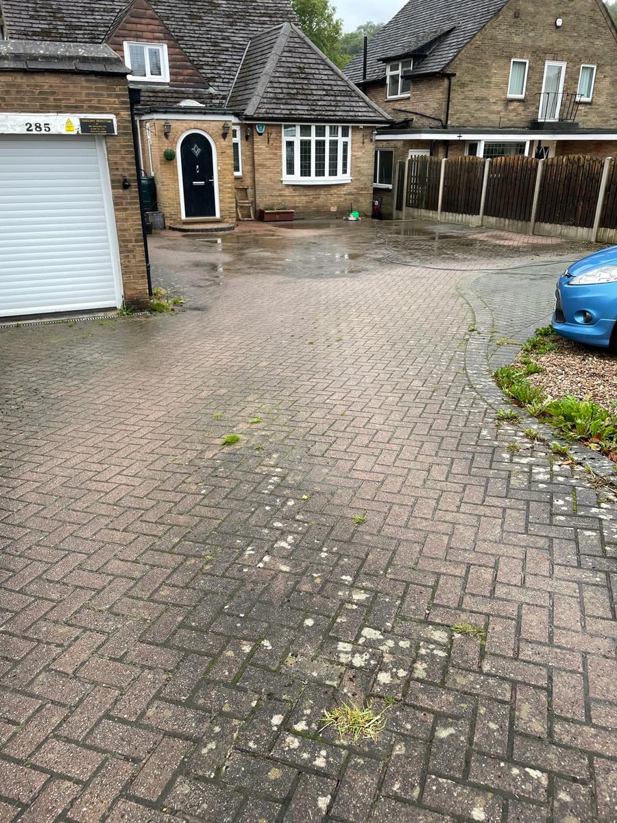 Dirty herringbone driveway before cleaning