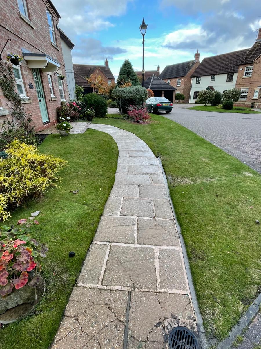 Cleaned flagstone path after pressure washing